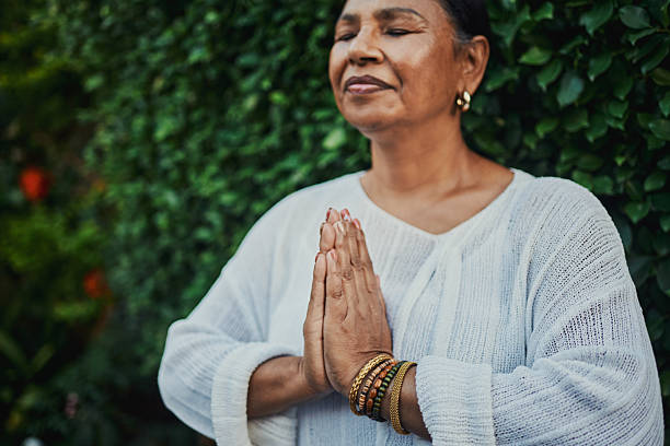 istock Peaceful Mature Woman Practicing Meditation Outdoors 2217395854