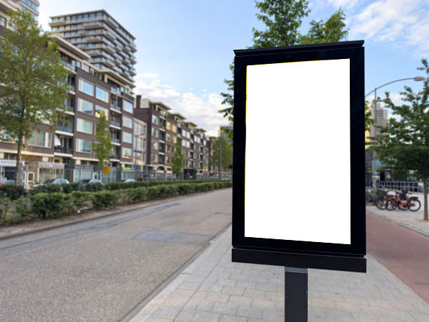 istock Blank advertise display stand, empty vertical billboard on the sidewalk. Modern buildings background. 2217396046