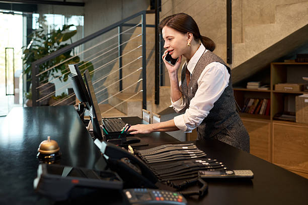 istock Receptionist Working Job at Desk in Modern Office Setting 2217396166