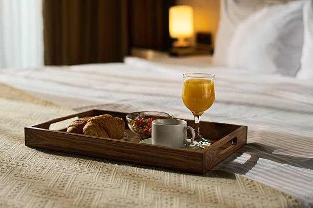 istock Enjoying Breakfast in Bed with Fresh Orange Juice 2217396174