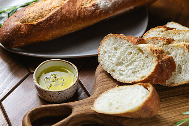 istock French baguette with olive oil and fresh rosemary on a kitchen table 2217398661