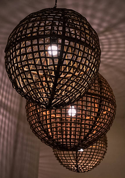 istock 3 wicker light fixtures with a warm glow 2217399312