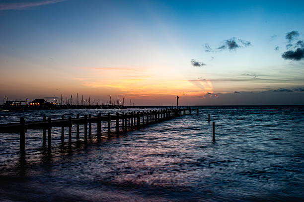 istock Fishing pier at sunset in Fairhope , Alabama with dramatic clouds. 2217399354
