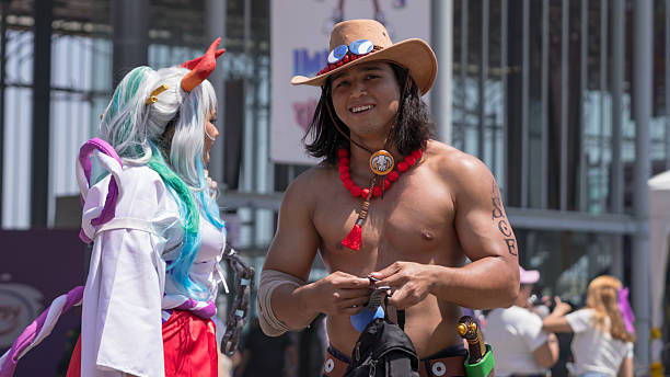 Geek Convention In GUAYAQUIL, ECUADOR - OCT 13, 2024 People dressed as anime characters participate in a cosplay event during an outdoor cultural convention.
