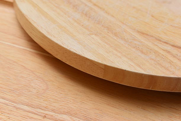 istock brown wooden sphere cuttingboard wood background 2217407671