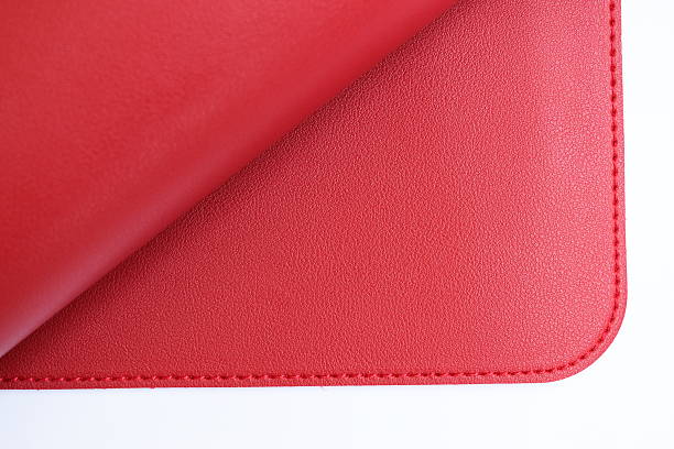 istock shiny red leather texture isolated on white background 2217408523
