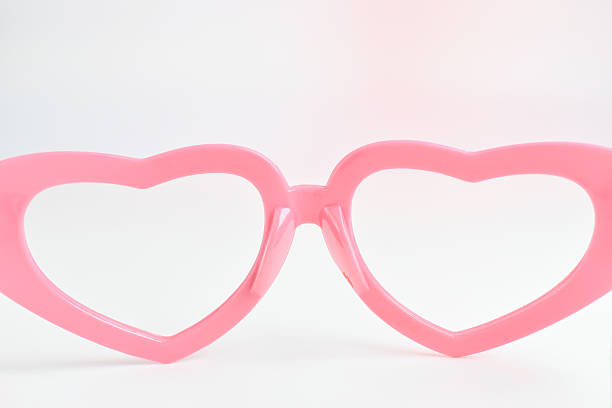 istock pink heart shape of glasses on white background 2217410681