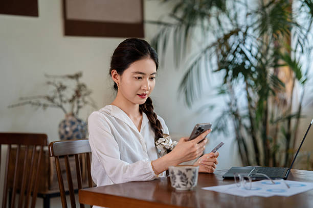 istock Asian young woman working at home 2217410786