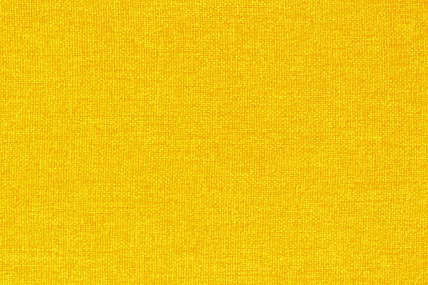 istock Yellow golden fabric cloth texture background, seamless pattern of natural textile. 2217410882