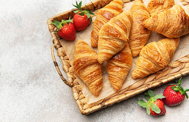 Freshly baked croissants and strawberries creating a delightful breakfast scene
