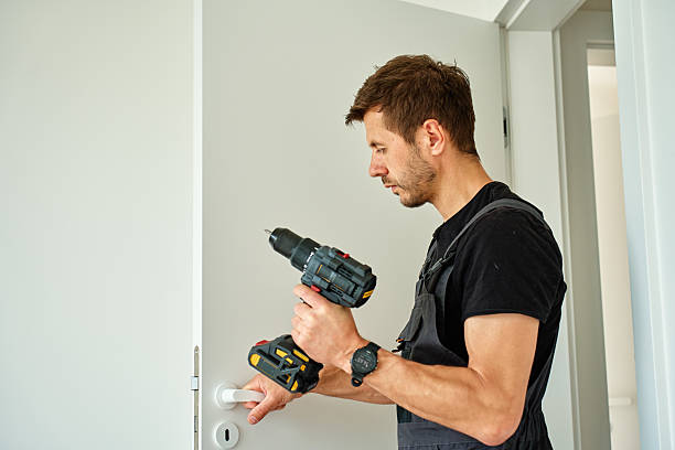 istock Man installs door in apartment during renovation 2217414538