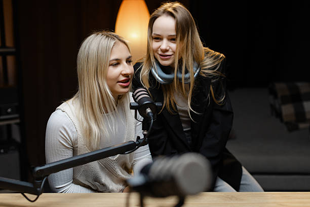 istock Two young women recording a podcast in a professional studio 2217415148