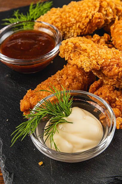 istock Delicious fried chicken served with two flavorful dips 2217415872