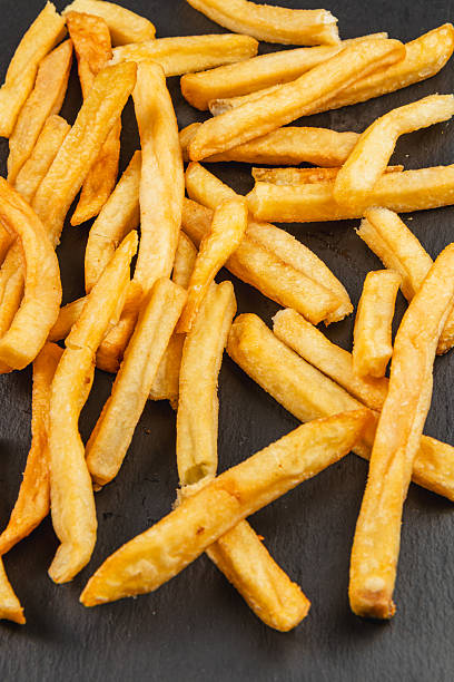 istock Freshly cooked fries on a dark surface ready to be enjoyed 2217417068