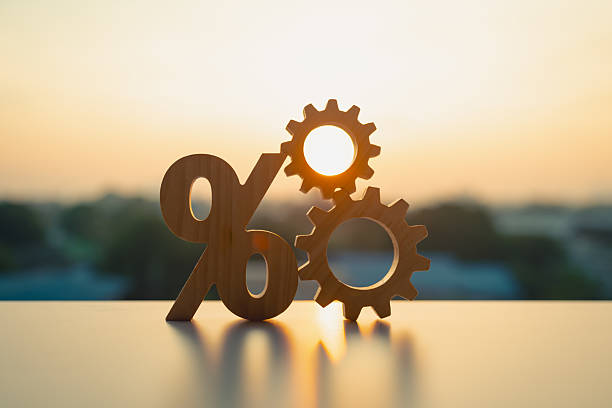 istock Percentage model and gear model with evening sky Key concepts for success, methods, systems of raising or lowering Fed interest rates to correct inflation concepts. 2217422900