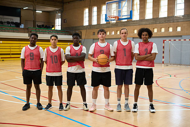 istock Basketball team posing on court before game 2217422995