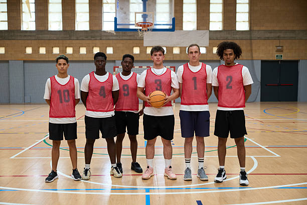 istock Basketball team posing on court before game 2217423000