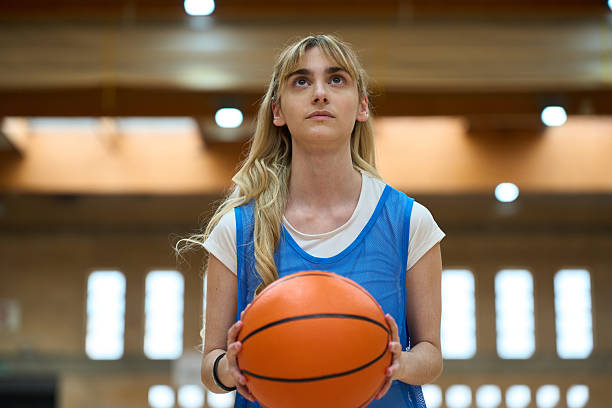 istock Young female basketball player concentrating before shooting 2217423239