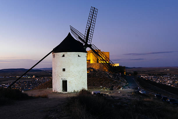 Windmills in Consuegra, Toledo. An icon of La Mancha. The windmills crowns a hill over the town and known worldwide thanks to Don Quixote. Night view