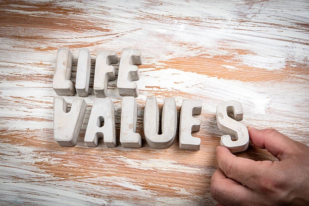 istock Life Values. Concrete alphabet letters on a light painted wood texture background 2217423332