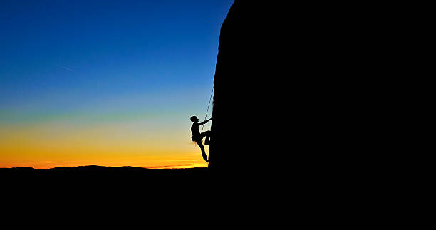Rock Climber's Silhouette Against a Sunset