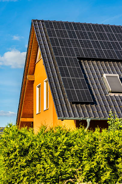 istock Roof with solar panels on a summer day 2217423973