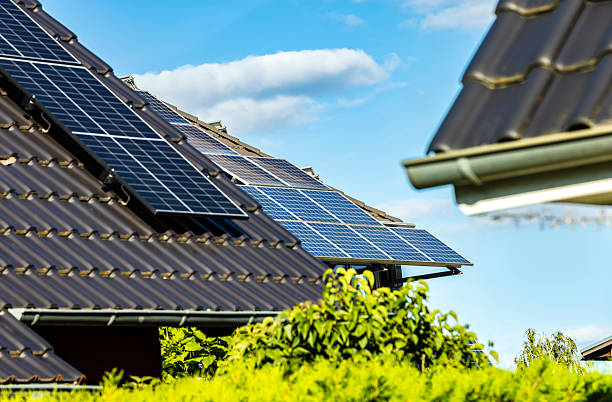 istock Roof with solar panels on a summer day 2217423974