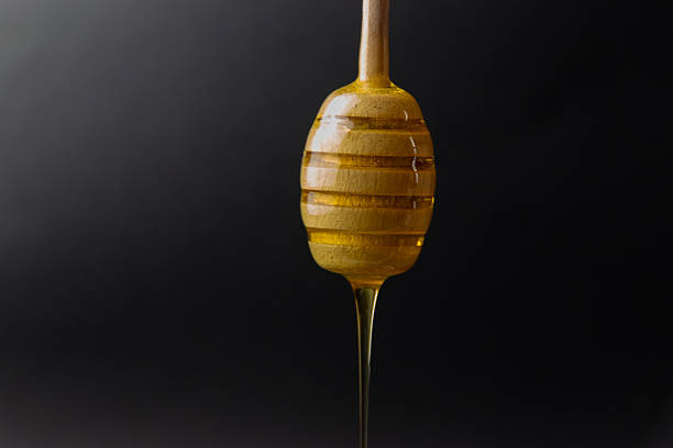 istock Honey in a honey dipper 2217424048