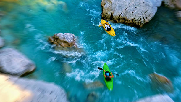 istock Kayakers navigate through rapids, showcasing thrilling whitewater adventure 2217425747