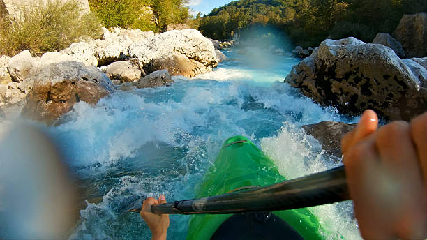 istock Kayaker conquers rapids, navigating through turbulent waters with skill and determination 2217425787