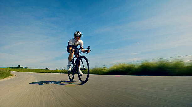 istock Riding on the open road: A cyclist's journey through nature 2217427619