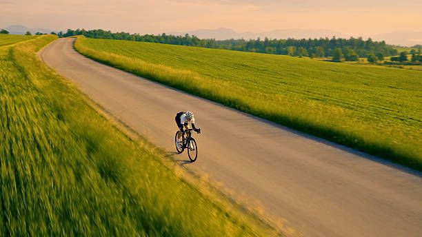 istock Rider speeds down a winding road, embracing nature's beauty 2217427636