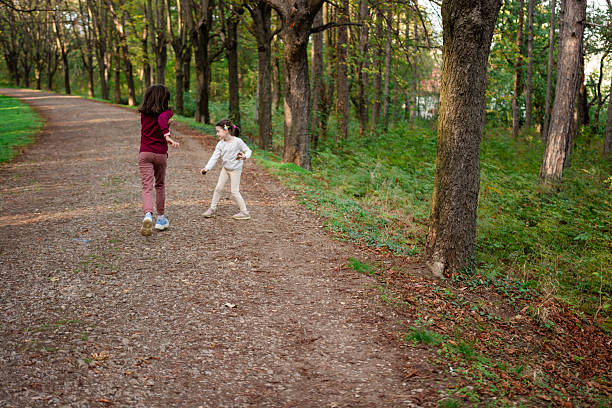 istock Children playing in park 2217429592