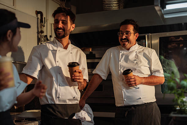 istock Chefs enjoying a coffee break in a restaurant kitchen 2217431699