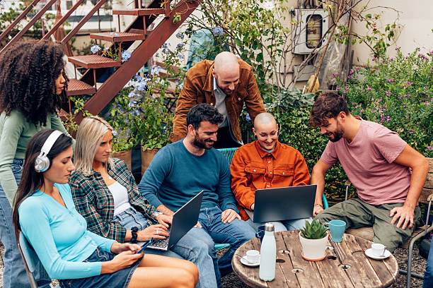 istock Coworkers having a meeting using laptops in a garden 2217432282