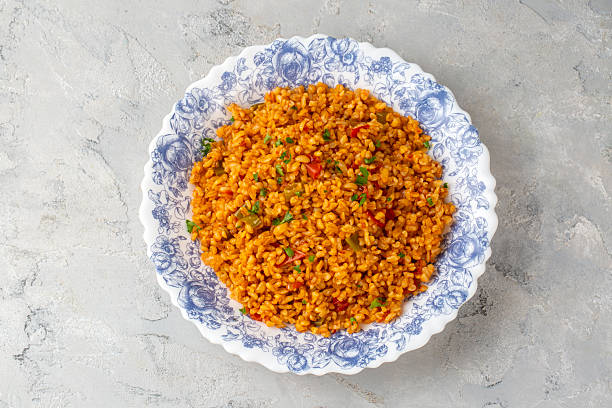 istock Traditional turkish bulgur pilaf with tomato sause in plate (Turkish name; meyhane pilavi) 2217433744