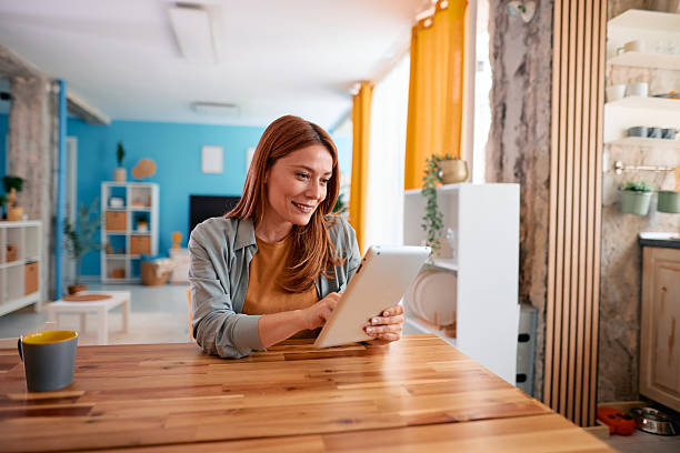 istock Woman using digital tablet at home, working remotely or enjoying leisure time 2217440635