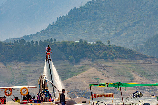 May20th Tehri Lake Uttarakhand India. A thrilling flyboarding experience at Tehri Lake, Uttarakhand, where riders soar above water using a jet pack.