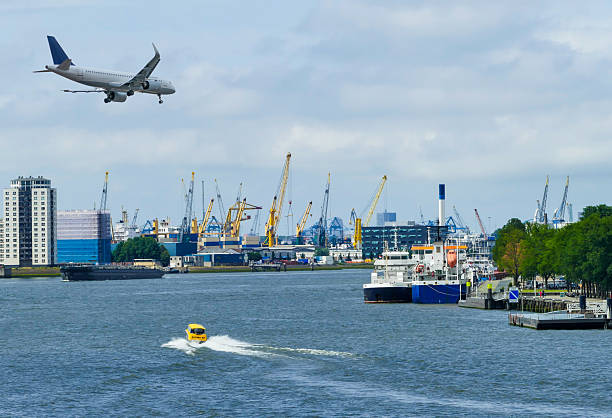 istock Plane on Sky over Harbor of Rotterdam Netherlands 2217444452