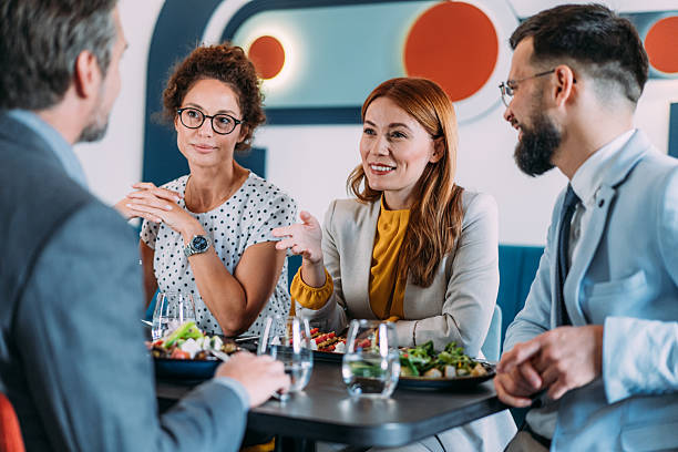 istock Businesspeople having lunch together. 2217445926