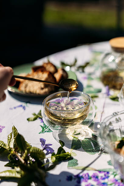 istock A golden teaspoon with tea drops illuminated by dramatic backlighting. Perfect for elegant beverage photography, luxury branding, and culinary visuals showcasing warmth and sophistication. 2217447162