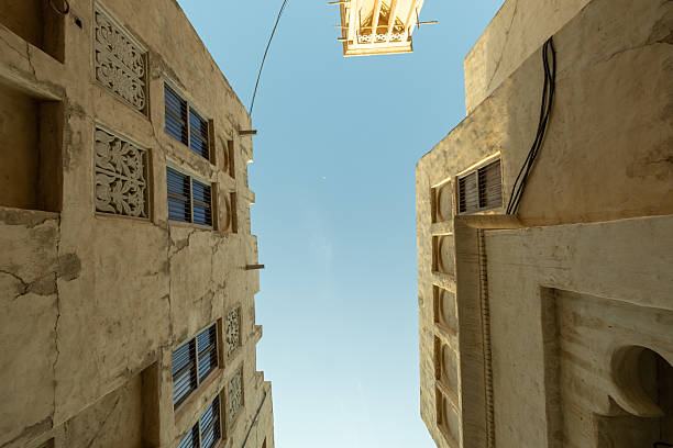 istock Sky View Between Traditional Sand-Colored Buildings, Dubai Al seef Heritage Architecture stock photos 2217449404