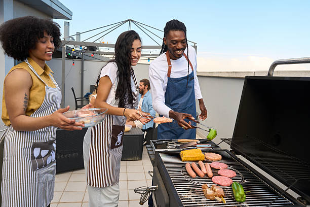 istock Friends grilling food and having fun on rooftop terrace 2217458791