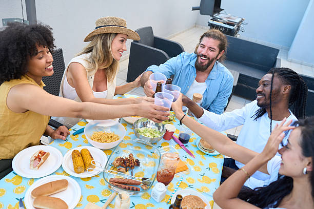 istock Happy friends toasting during a rooftop barbecue party 2217458867