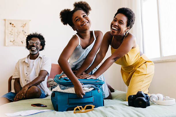 istock Excited family packing a suitcase together for a fun vacation 2217458932