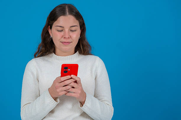 istock Upset man showing smartphone screen to camera with angry expression in city 2217459038