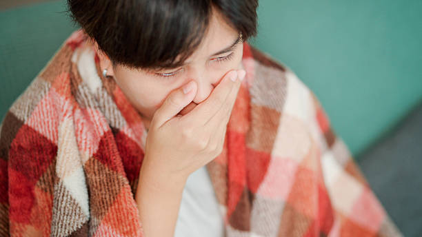 istock Asian woman coughing 2217459052