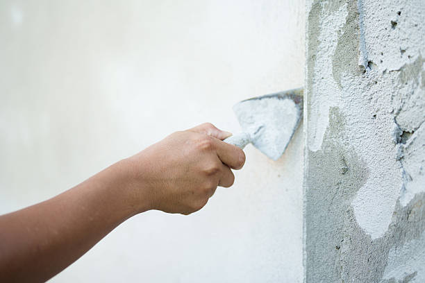 istock Applying plaster to wall home renovation site construction process indoor environment close-up view craftsmanship technique 2217461659