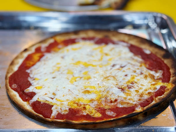 istock pizza with mozzarella, tomato and cheese on the table 2217461985