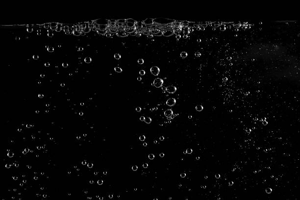 istock Underwater bubbles, Underwater oxygen design concept, Small water drops underwater, On black background, Close-up photography. 2217462134